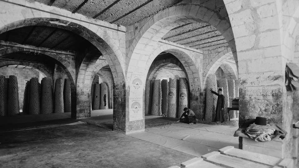The soap factory. General view of the stock room. Soap piled in stacks to complete drying, Nablus