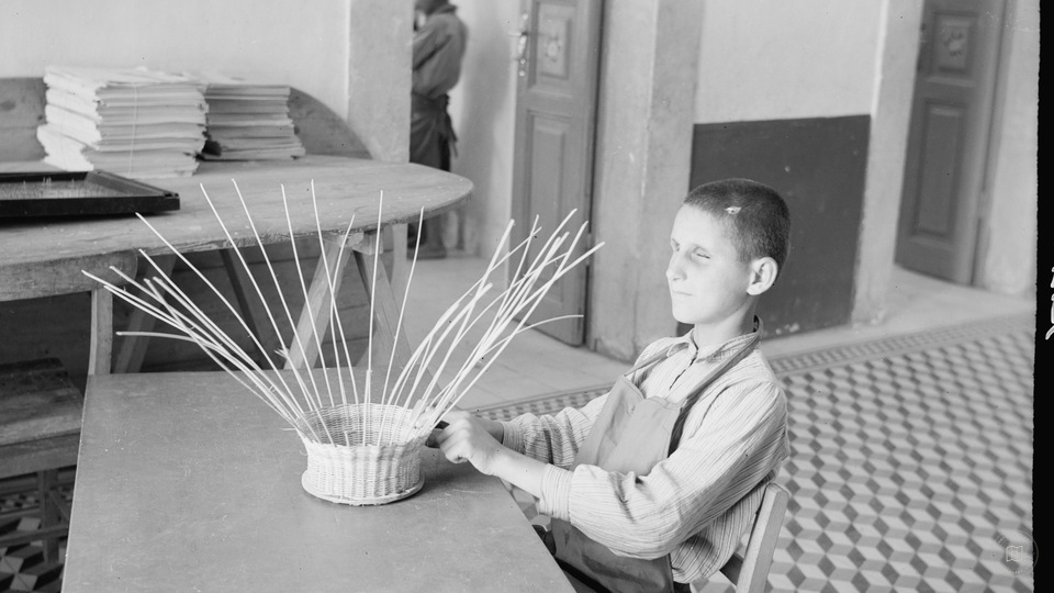Blind school in Hebron. Close up of boy doing basket work